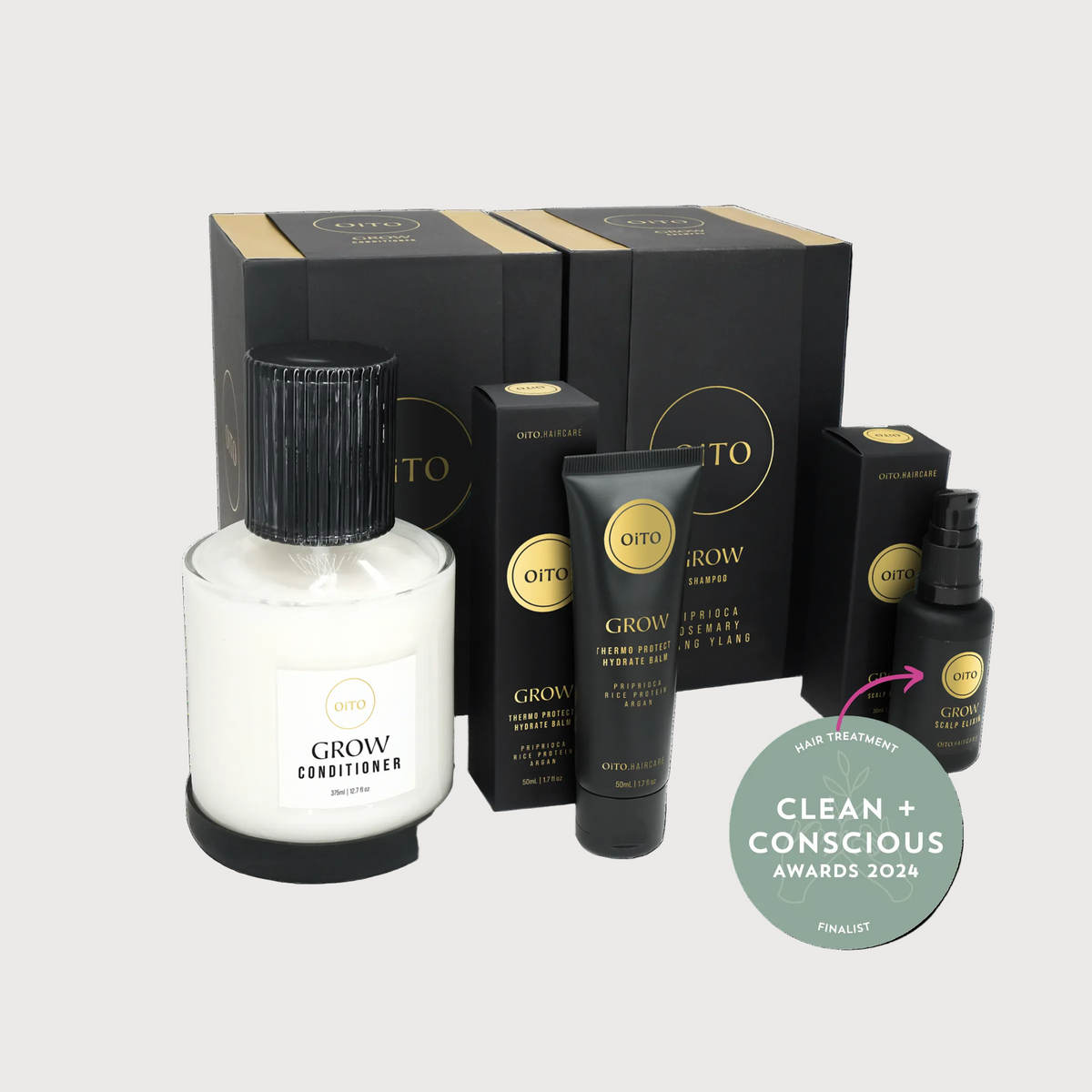 Outo hair care product set with bottles and boxes on a white background, featuring 'Clean + Conscious' award badge.