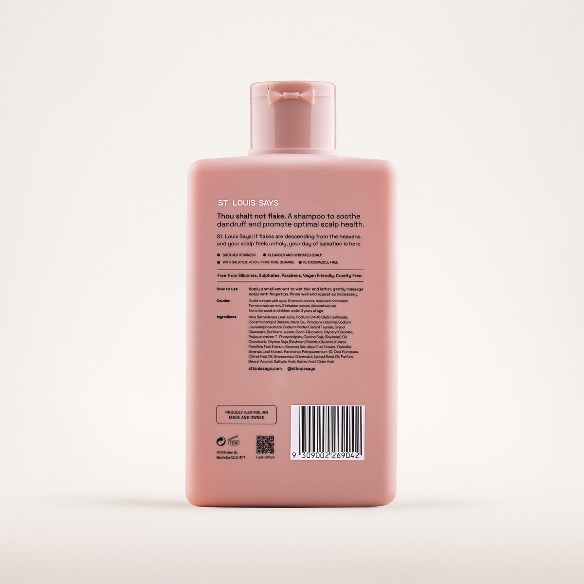 Pink shampoo bottle with label on a white background