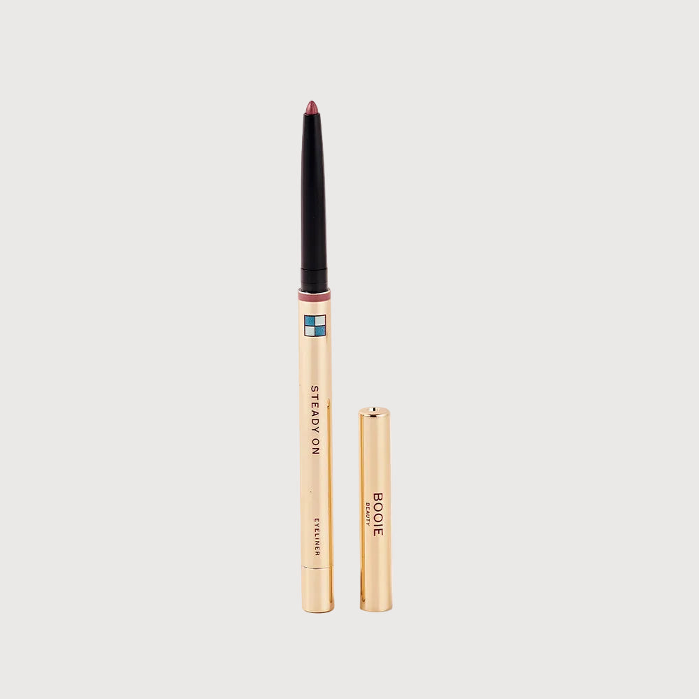 Two makeup products, a pencil and a compact, on a light pink background.