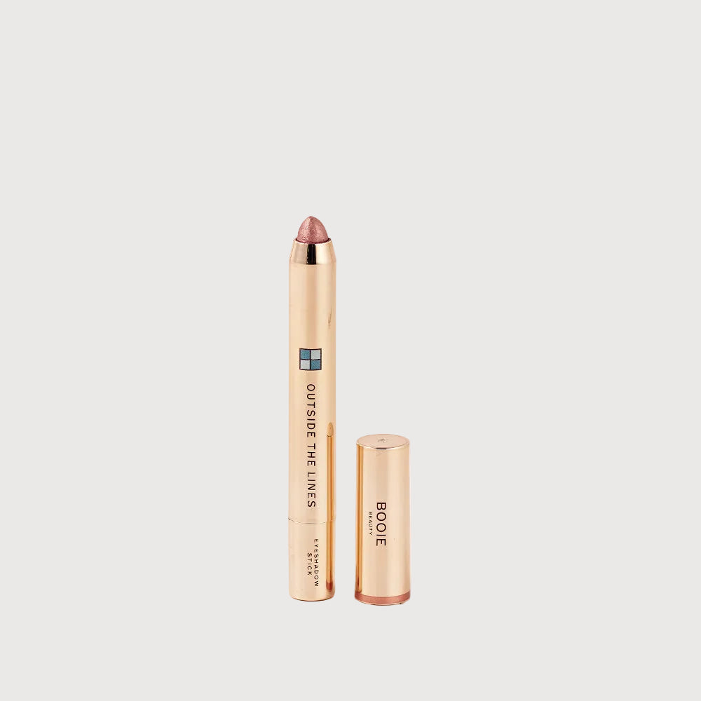 Boole lip crayon with cap on a light pink background