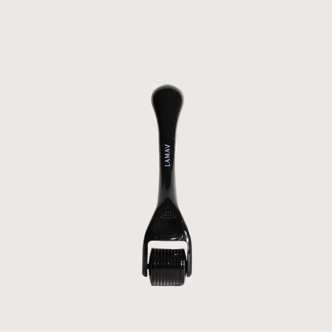 Black derma roller on a white background