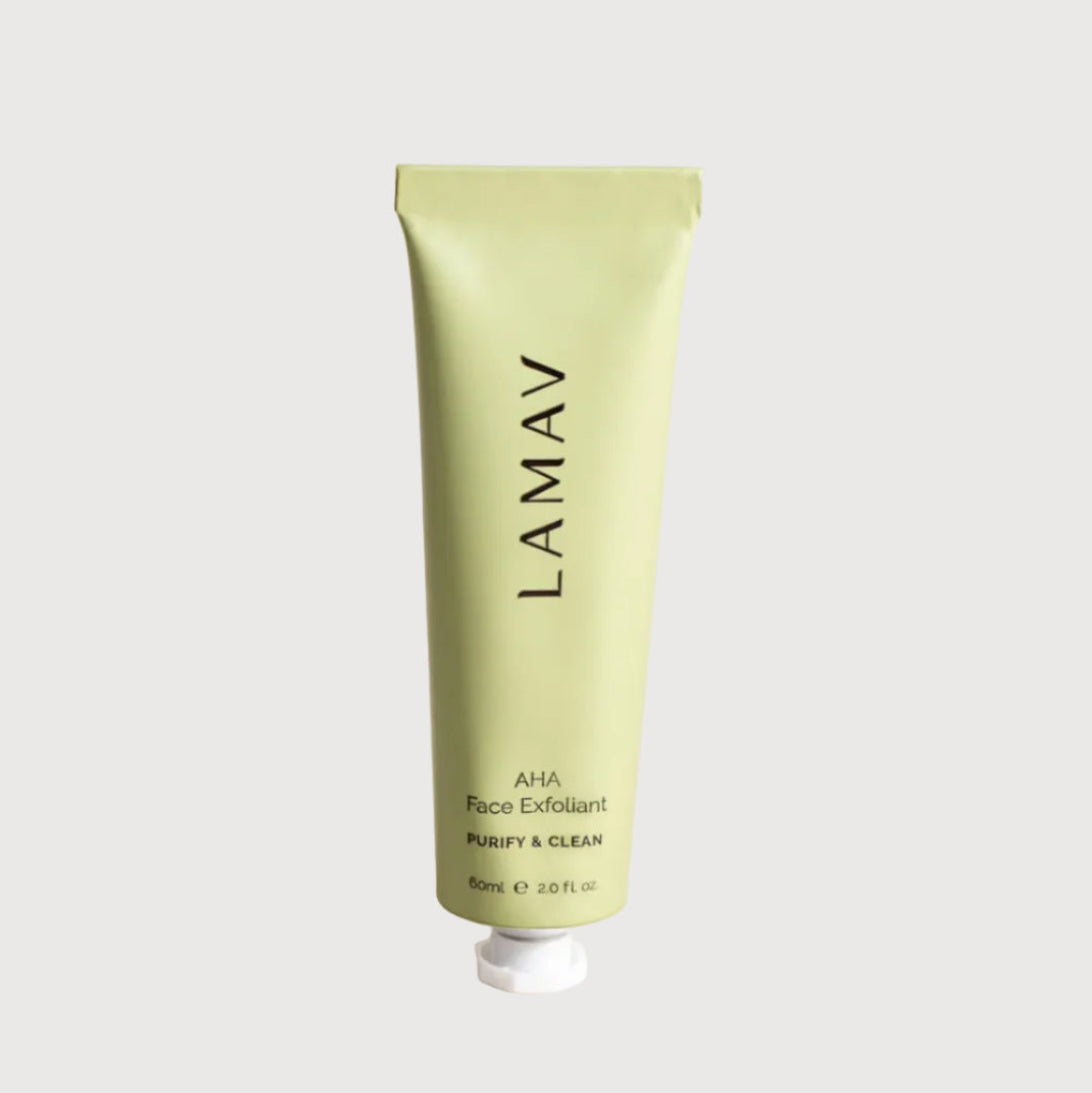 Green tube of LAMAV AHA Face Exfoliant on a light beige background
