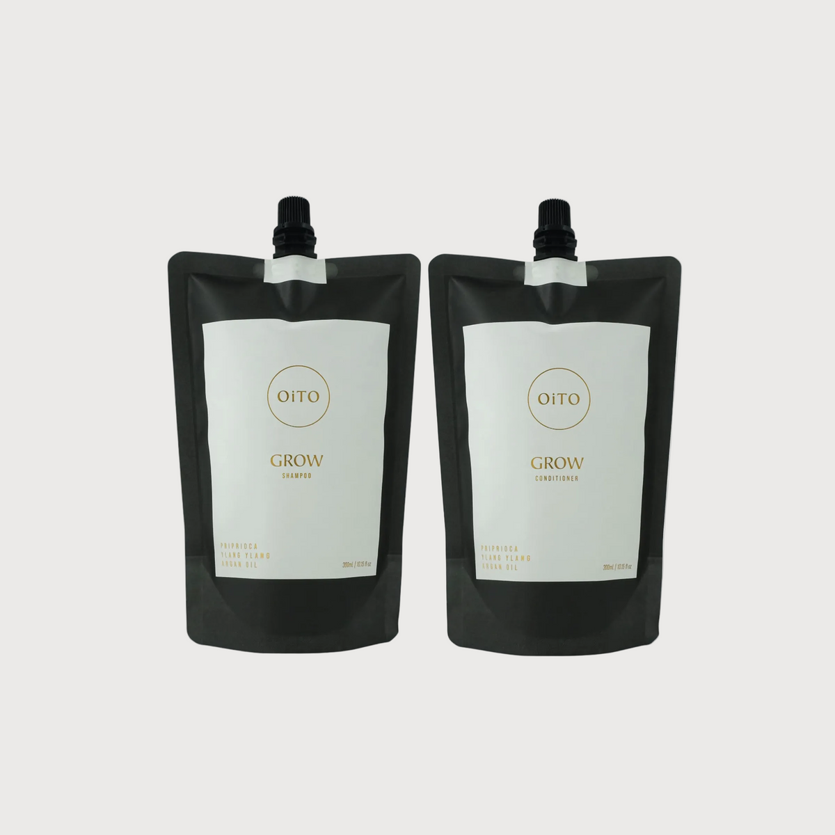 Two black Oito Grow containers on a white background