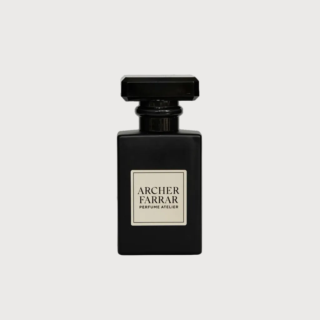 A black rectangular perfume bottle with a square cap and a cream-colored label reading 'ARCHER FARRAR PERFUME KILLER', centered on a light gray background.