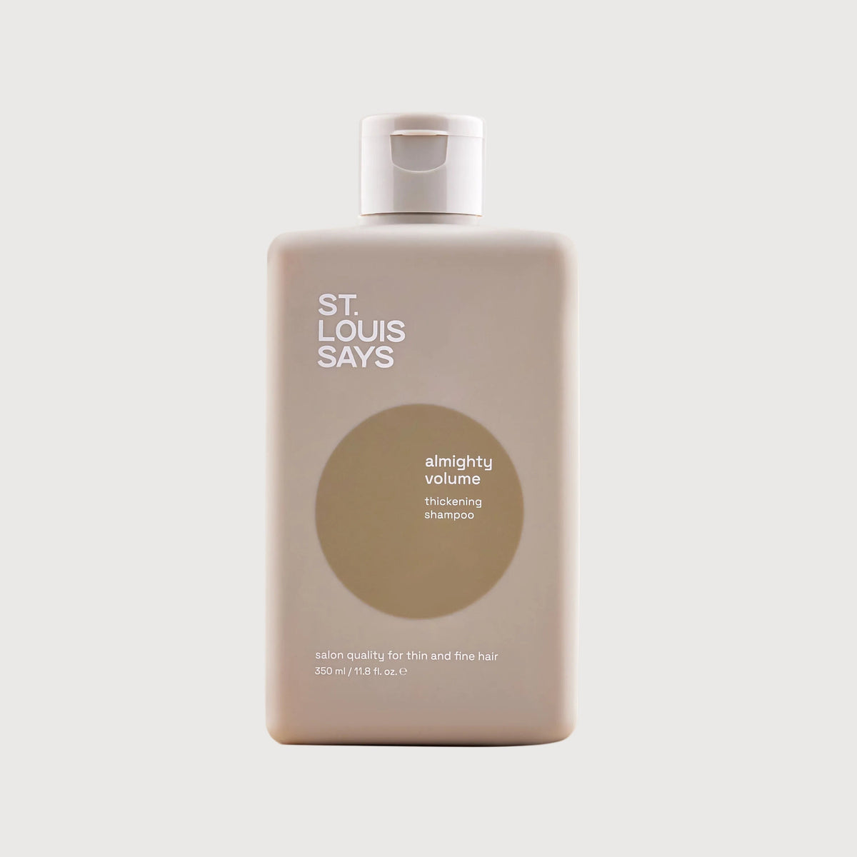 Shampoo bottle labeled 'St. Louis Says' on a light background