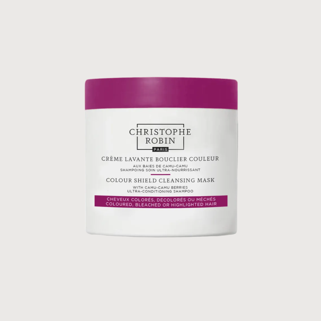 White jar with purple lid of Christophe Robin hair care product on a white background