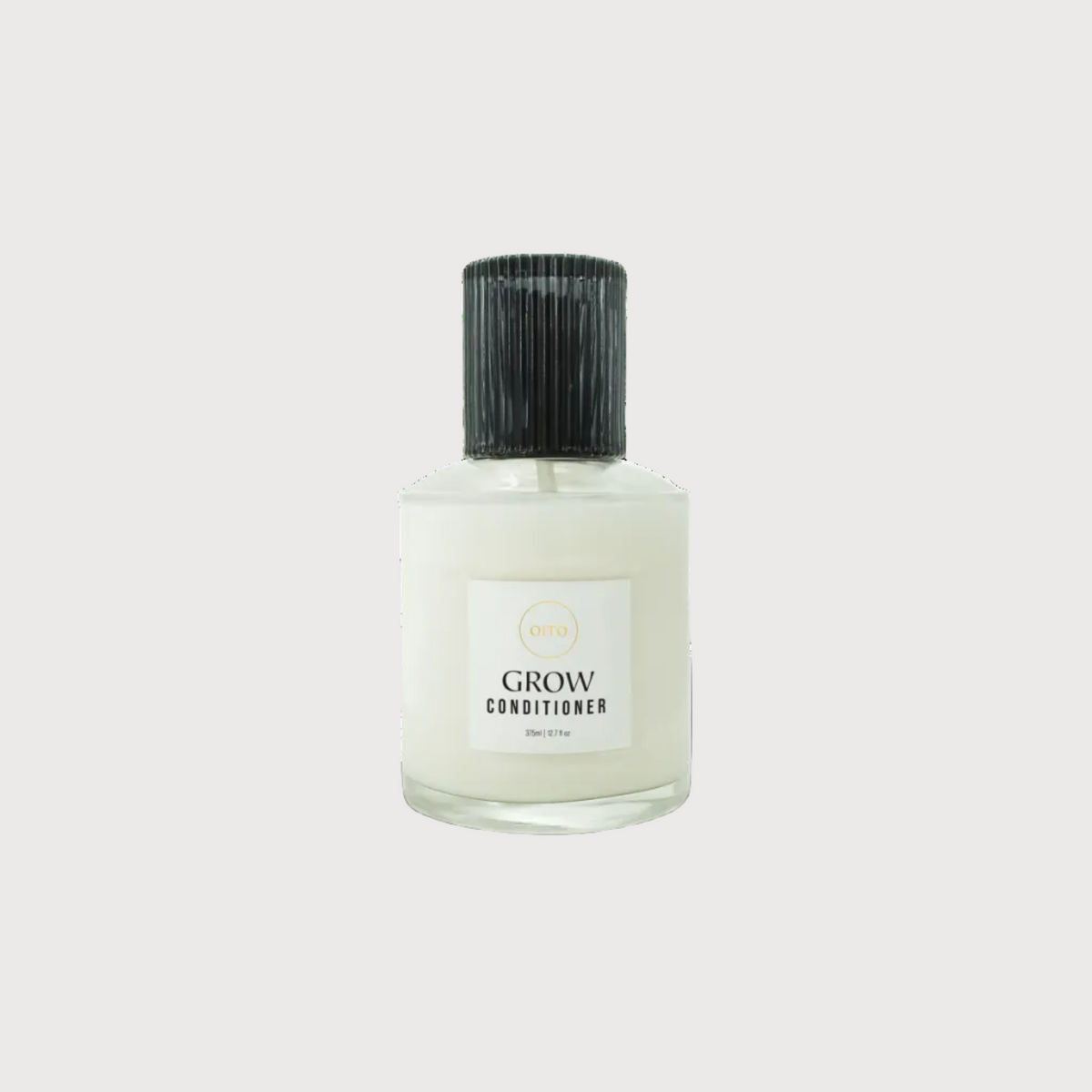 Bottle of 'Grow' conditioner on a white background