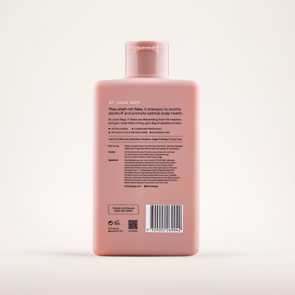 Pink shampoo bottle with label on a white background