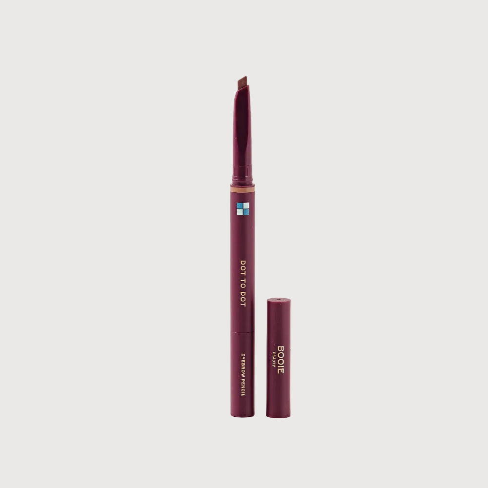 Brow pencil with cap on a light pink background