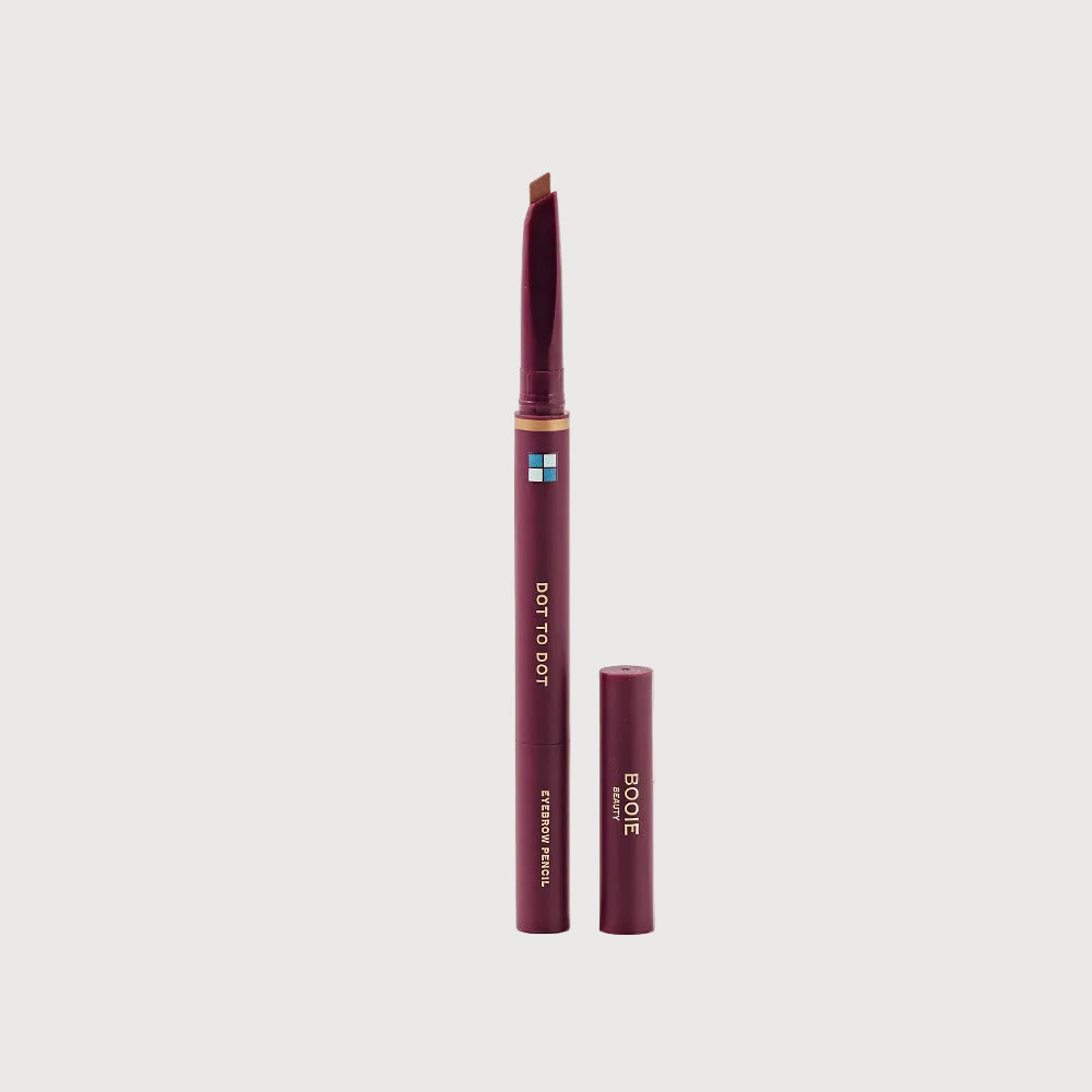 Eyebrow pencil with cap on a light pink background
