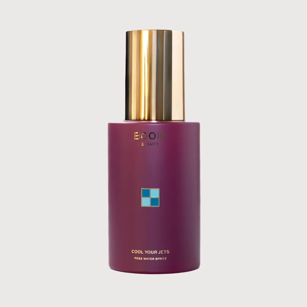 Purple bottle with gold cap on a white background