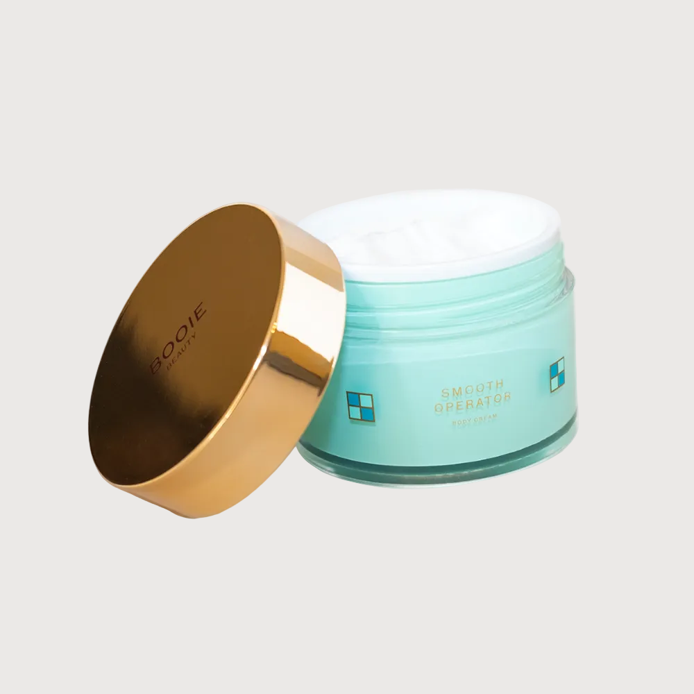 Cosmetic jar with gold lid and blue body on a white background