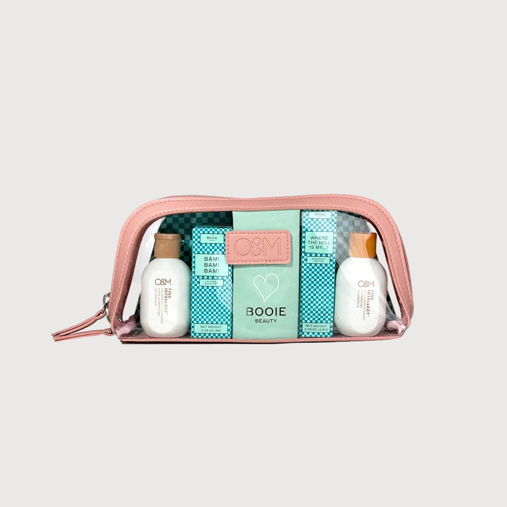 Cosmetic bag with beauty products on a light gray background