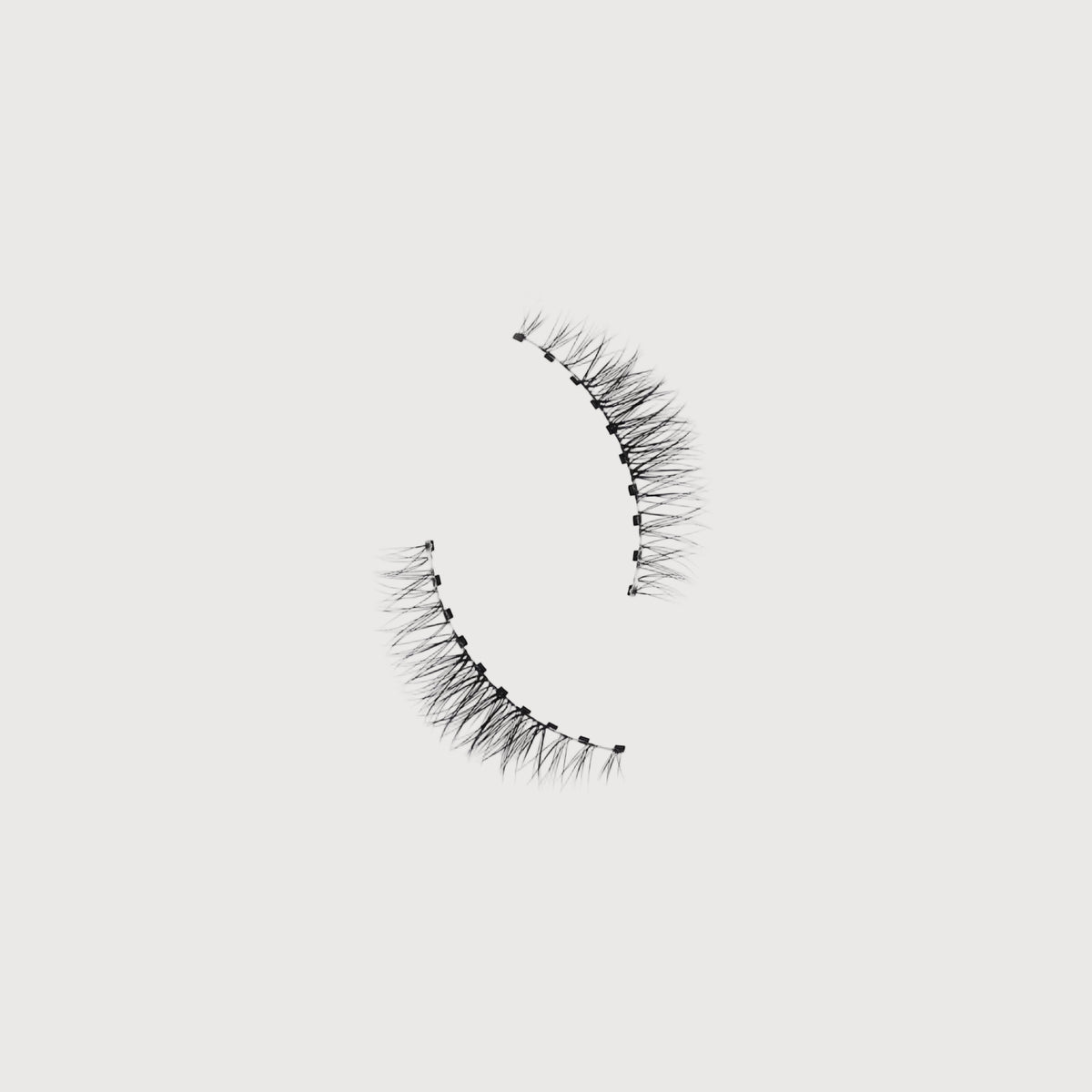 Pair of false eyelashes on a white background