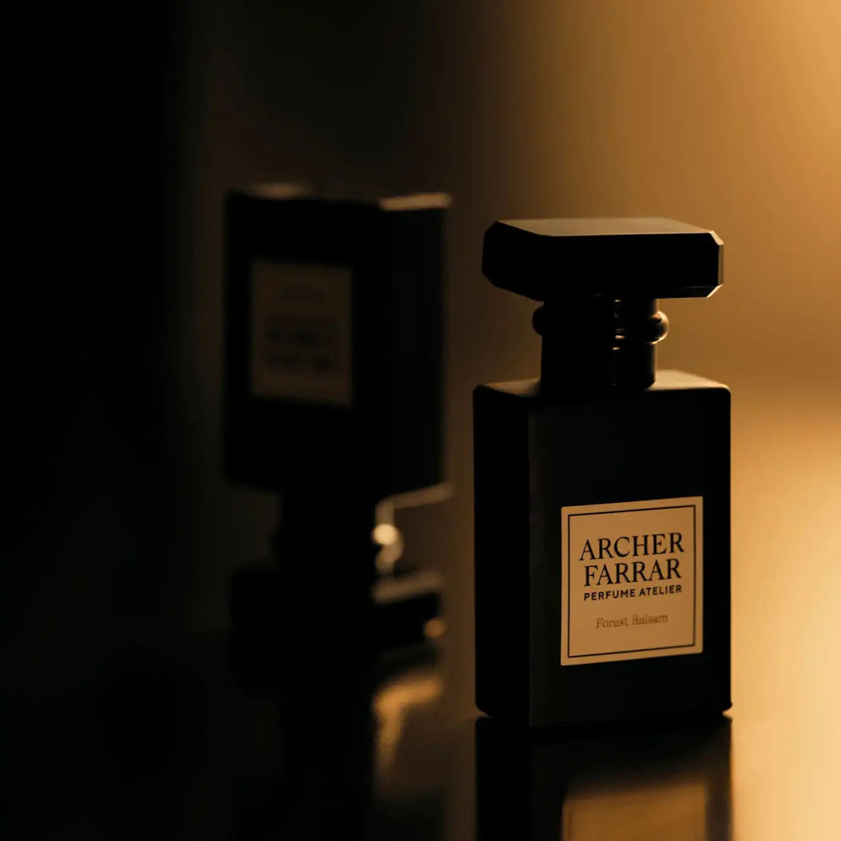 Perfume bottle labeled 'Archer Farrar' in a dimly lit setting