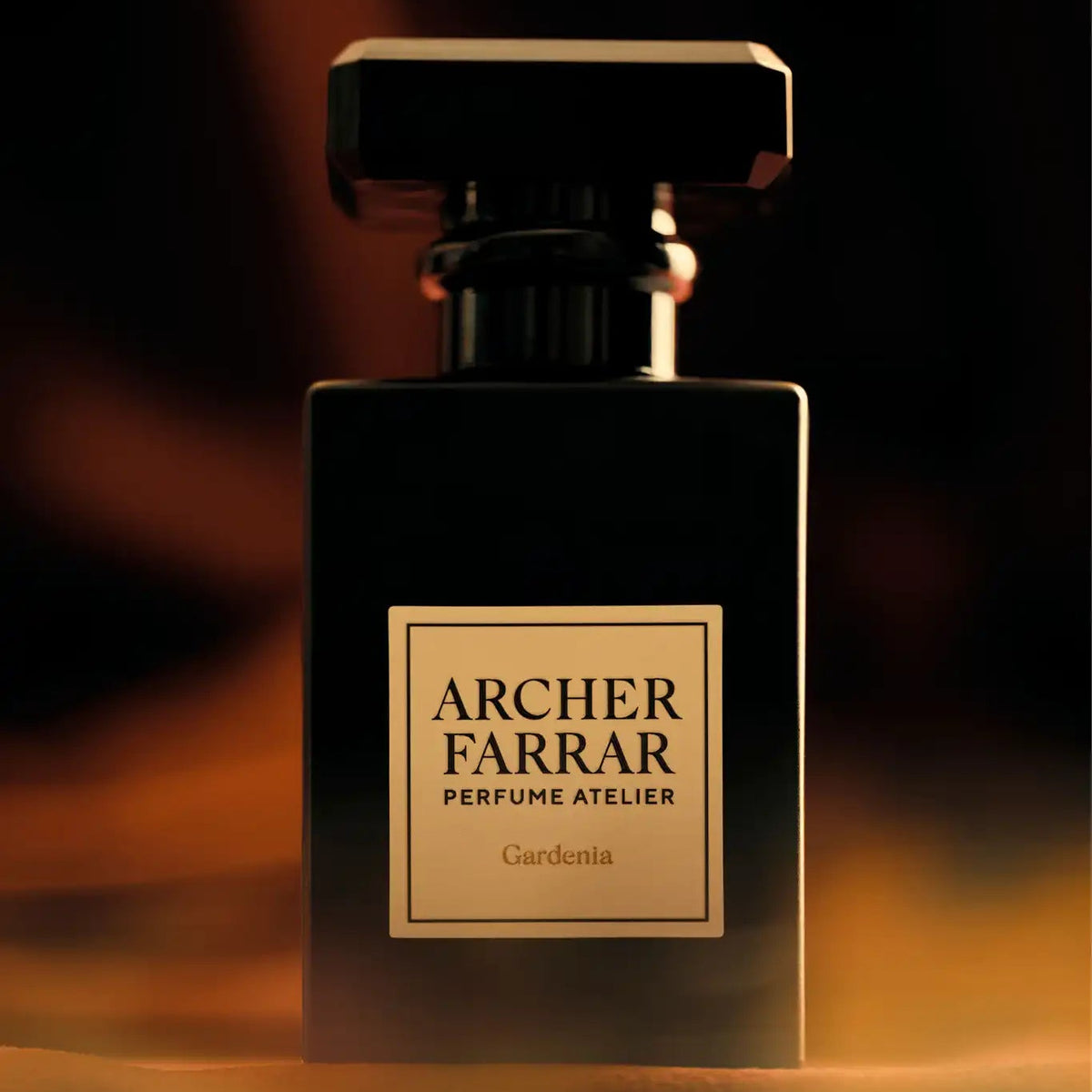Perfume bottle labeled 'Archer Farrar' on a dark background