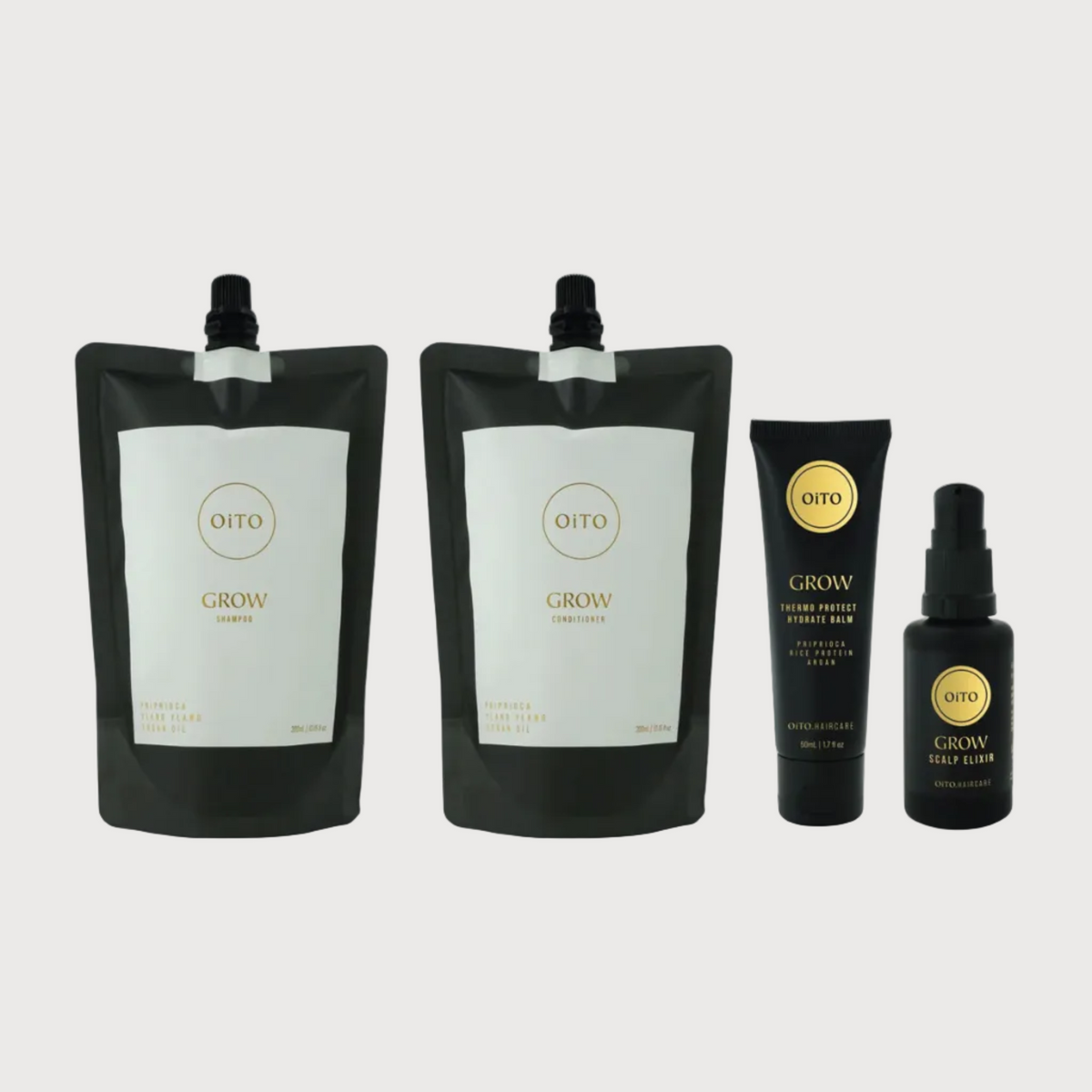 Set of OITO Grow products including large and small bottles on a white background