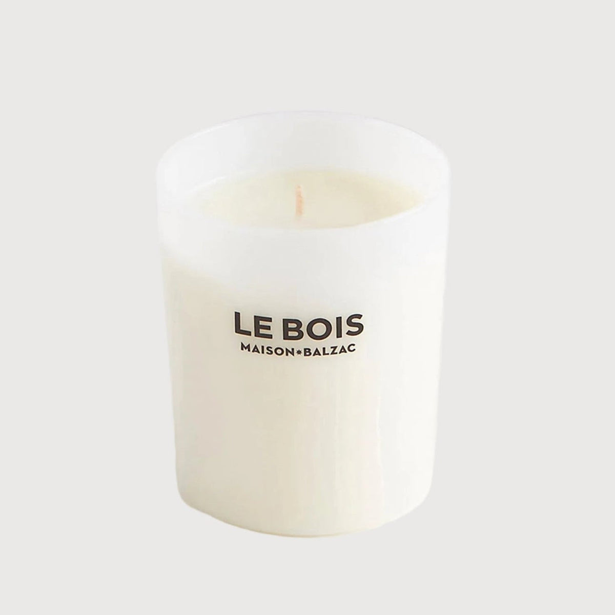 White candle with 'LE BOIS' branding on a white background