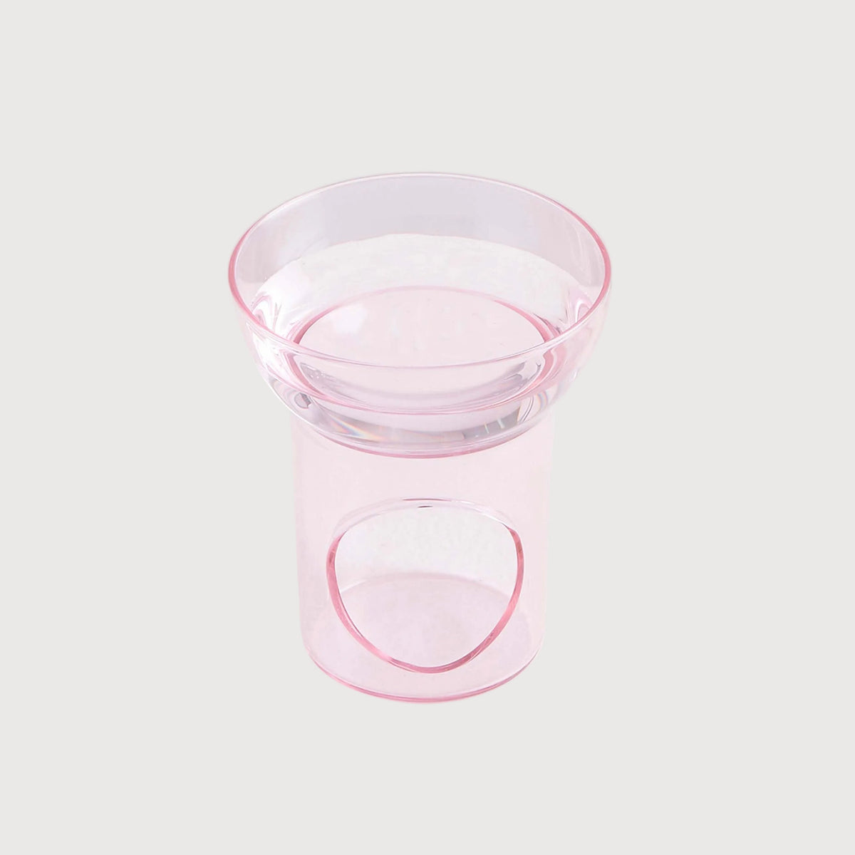 Clear glass bowl with pink rim on a white background