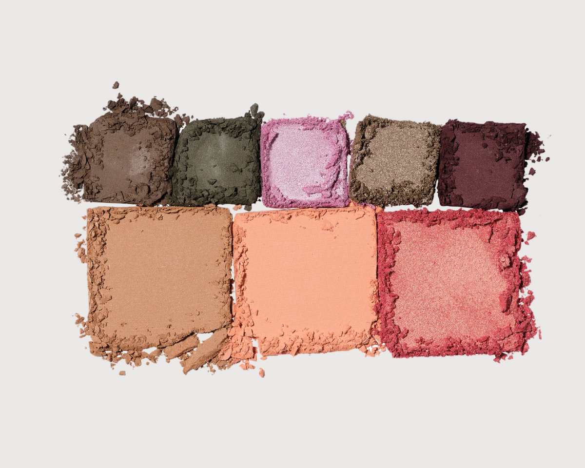Makeup color swatches arranged in a row on a white background