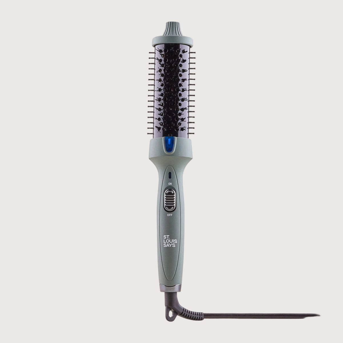 Hair straightener on a light beige background