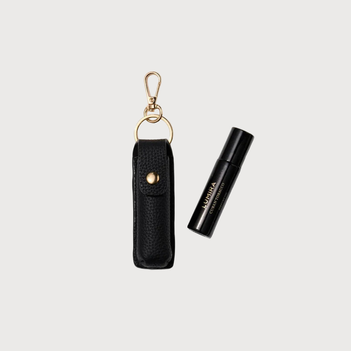 Black lip balm with keychain holder on a white background