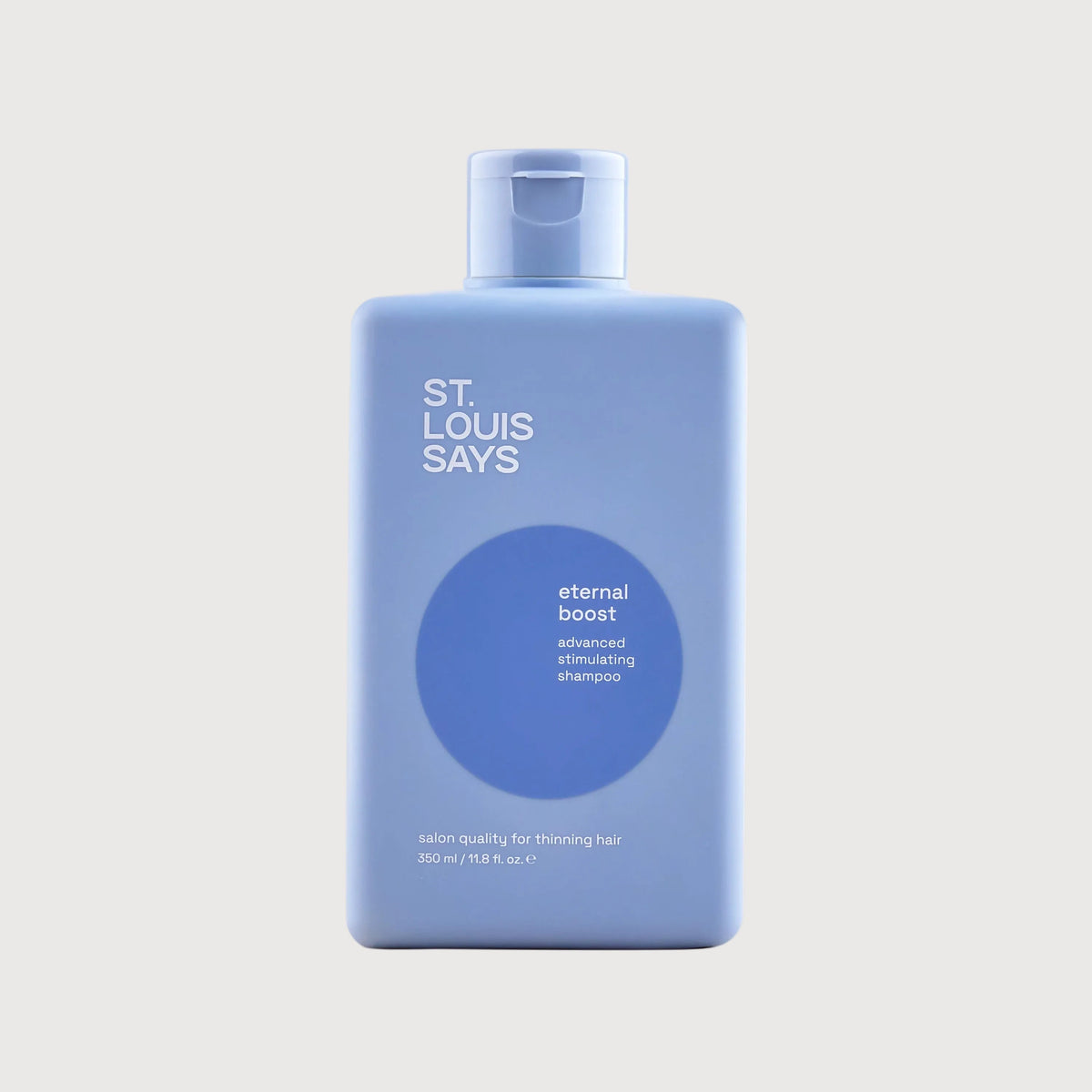 Blue bottle labeled 'St. Louis Says eternal boost' on a light gray background
