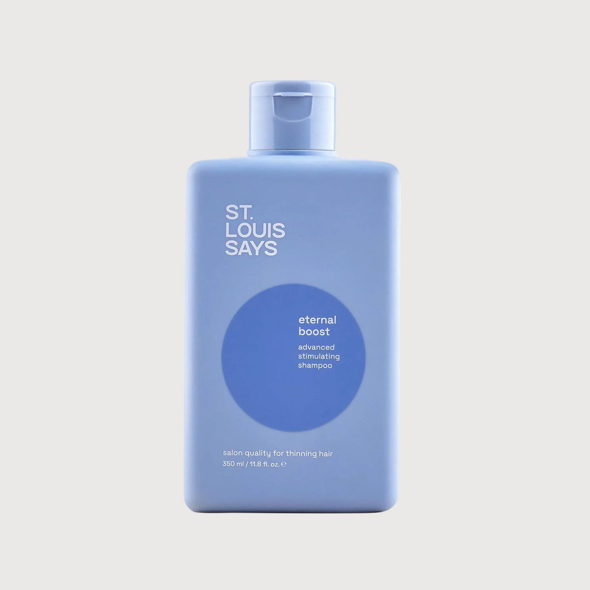 Blue bottle labeled 'St. Louis Says eternal boost' on a light gray background